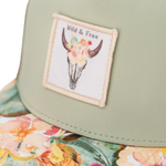 Load image into Gallery viewer, Boho chic for your little explorers in this desert inspired hat, named after my favorite spot in the U.S. Light green bamboo fabric on the front with a flowered bison skull patch. The perfectly curved brim is adorned with a desert flower print. Trucker style to keep your toddlers cool all summer long is simply fabulous!

