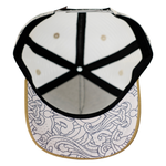 Load image into Gallery viewer, Brim detail showing wave print under brim of Baja kids snapback hat
