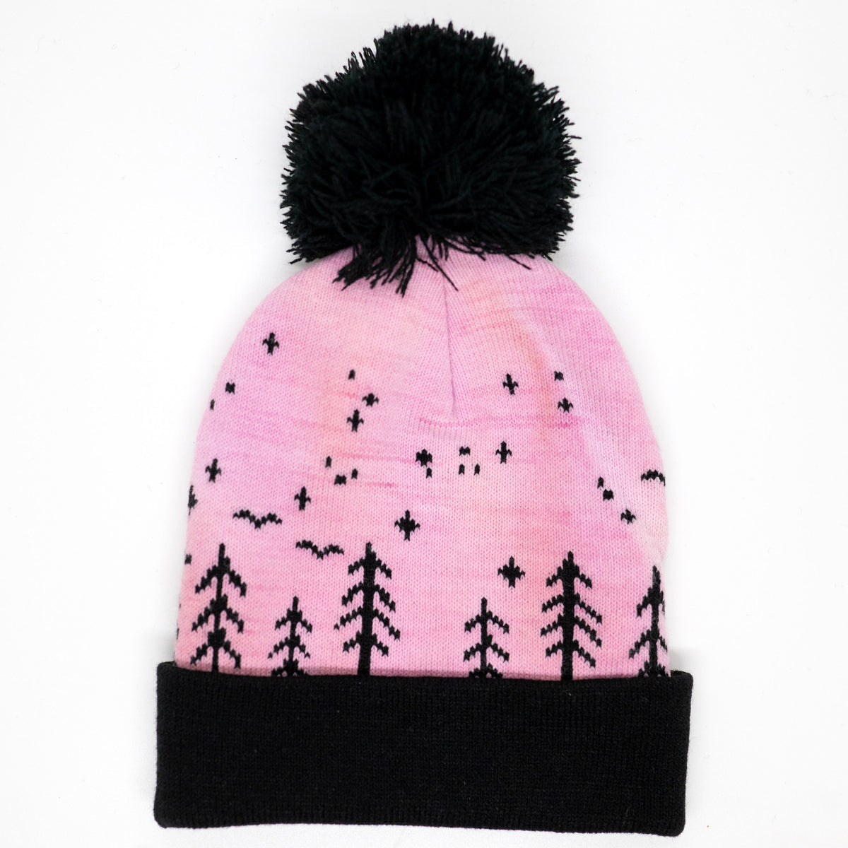 Pink hand-dyed kids winter beanie with black pom-pom, folded cuff, pine trees, moon and stars.