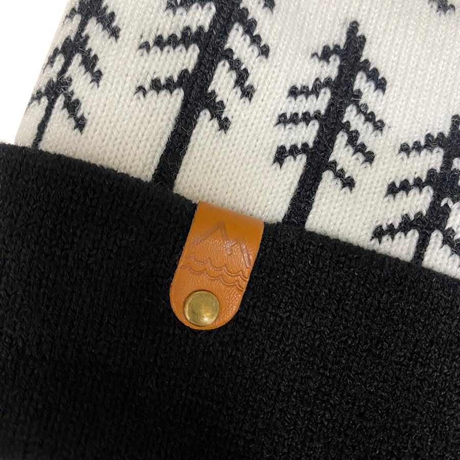 Black and white Winter beanie for kids with pine trees and moon design. Neutral clothes for kids.