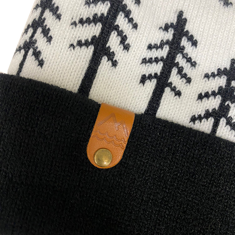 Black and white Winter beanie for kids with pine trees and moon design. Neutral clothes for kids.
