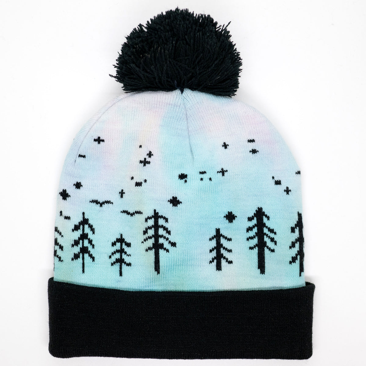 Hand-dyed kids winter beanie fading from lavender to light blue with black pom-pom and forest design.