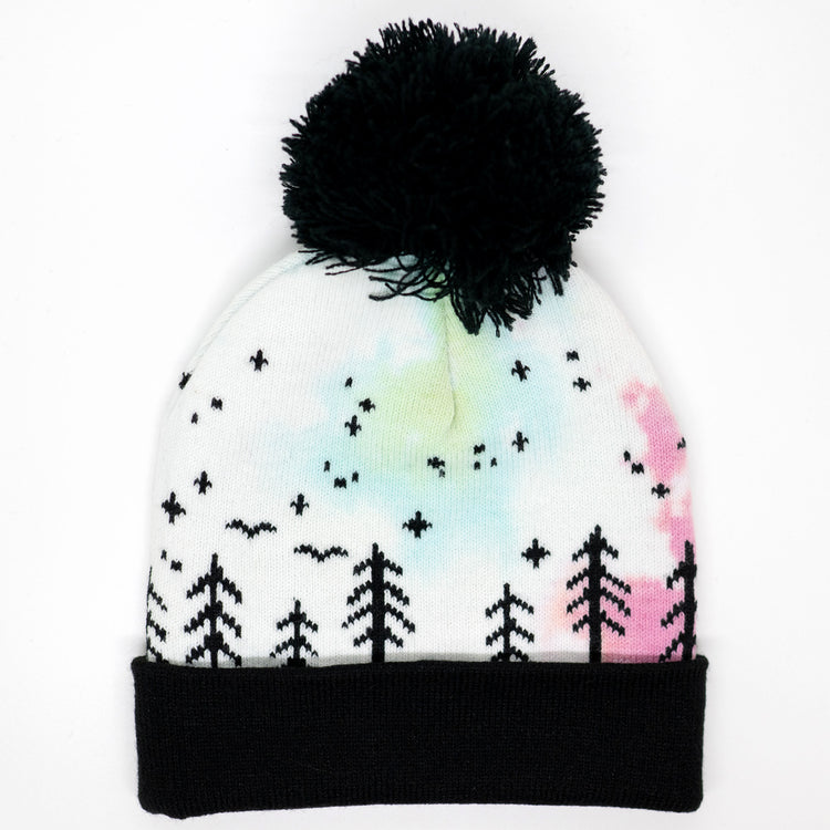 Hand-dyed pink, yellow, blue, and purple kids winter beanie with black pom-pom, folded cuff, pine trees, moon and stars.