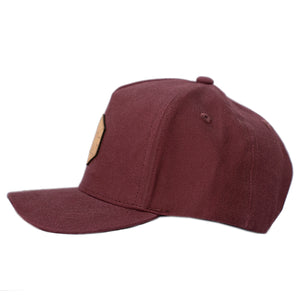 Neutral colored kid's hat. Deep red hat for hiking.