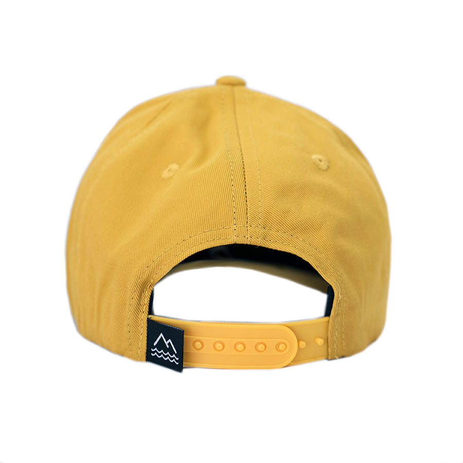 Aspen is our yellow snapback hat for toddlers and kids. Aspen gold with mountains and a sun design. Hats that fit toddler and big kids.