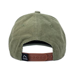 Load image into Gallery viewer, Green corduroy hat for toddlers and children with a brown leather patch.
