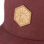 Load image into Gallery viewer, Close up of mountain embroidery on red kids snapback hat
