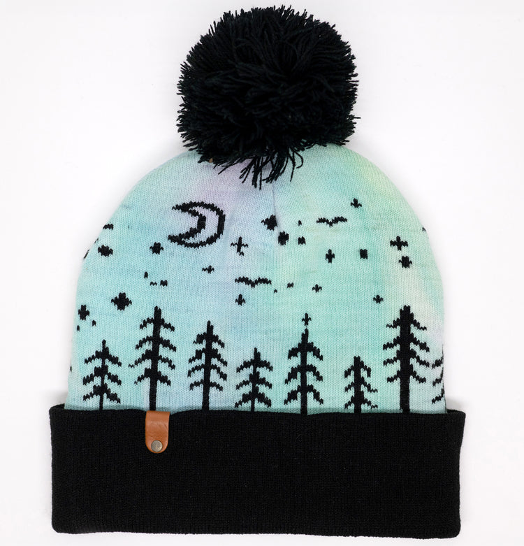 Rascals size Auroras kids' beanie, hand-dyed mint and lavender with a moon, stars and pine tree pattern and a black pom-pom