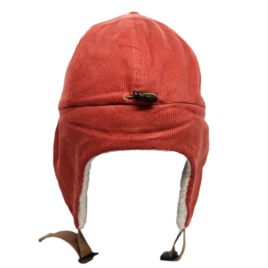 A cross between burnt orange and tomato red, our Zion Wooly children's flap hat is sure to keep your kids warm and stylish this winter. Our kid's winter trapper hats are fully lined with soft white fleece, warm corduroy outer shell, and a curved brim to keep the snow or winter sun off of their faces. Best yet, they have a pull cord on the back to customize your fit. Wear them clipped up or down, just be sure to get one for your winter adventures!